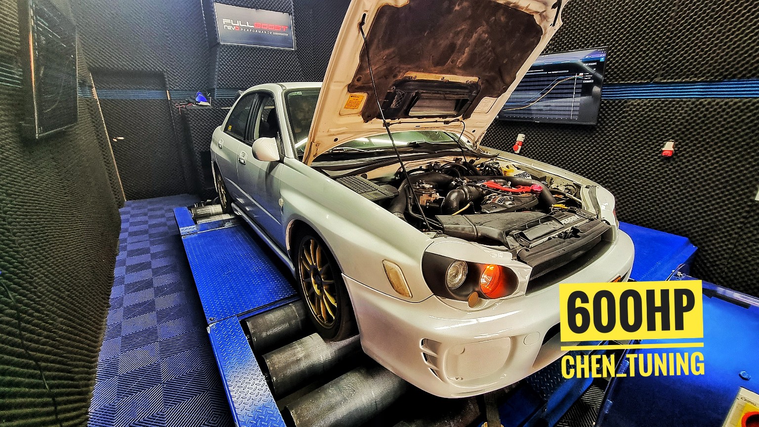 600 horsepower white Subaru on the dyno